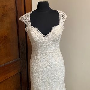 Eddy K wedding dress, Size 8, it was used as a try on dress at the bridal salon.